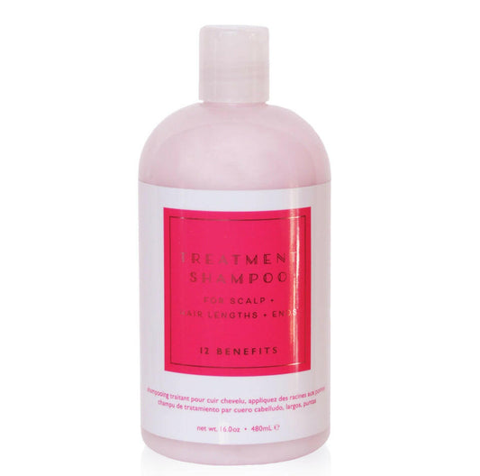 A pink bottle of Treatment Shampoo with black and white text detailing the product's benefits.
