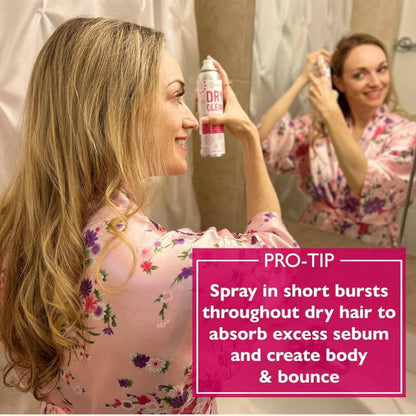 A woman with a can of 12 Benefits Dry Clean dry shampoo with instructions for use listed.
