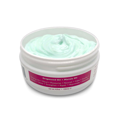 A white jar with a pink label that reads 'CBD Deep Moisture Hair Masque 250mg CBD'. The brand's logo is also visible on the label.