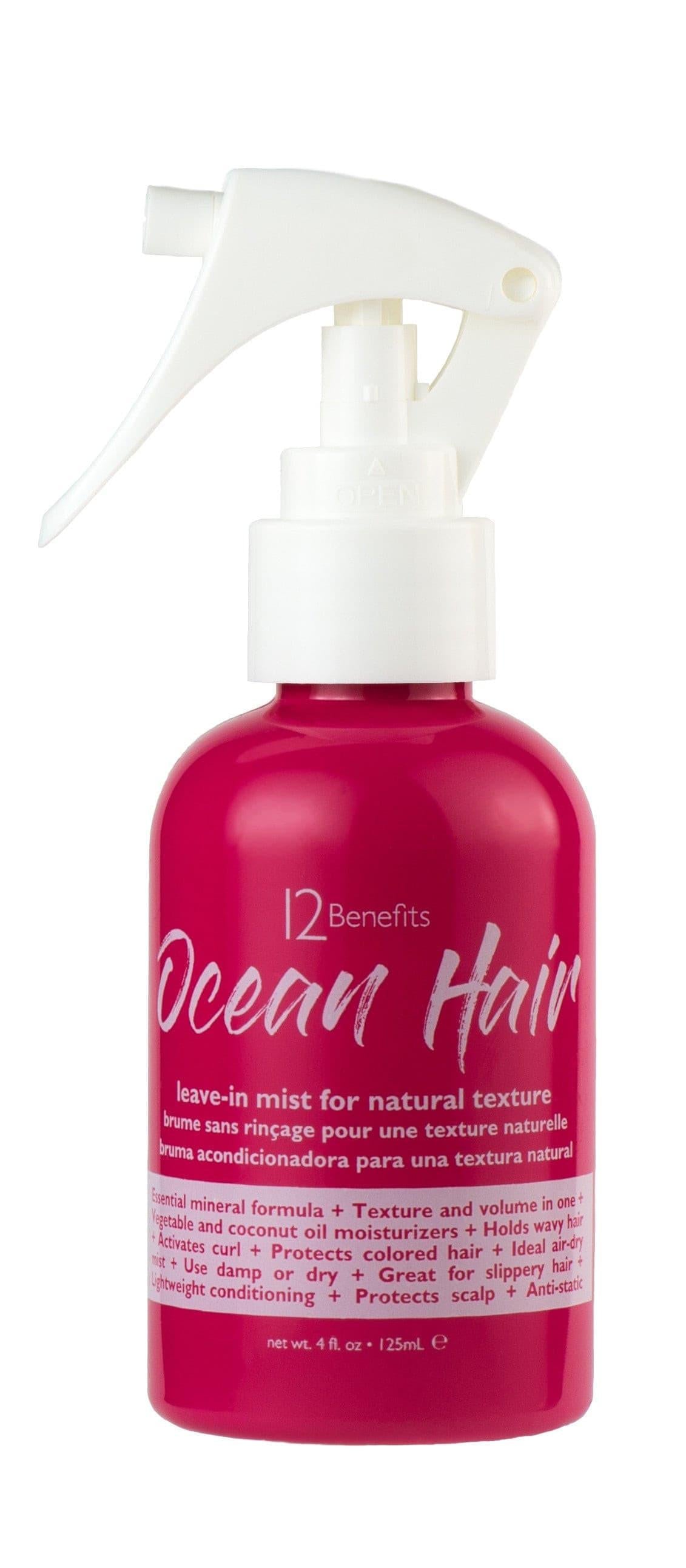 Pink bottle with white spray nozzle labeled '12 Benefits Ocean Hair' on a white background with written words leave-in mist for natural texture 